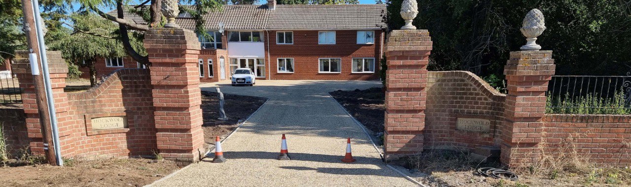 This is a photo of a newly installed chip and tar driveway, installed by Littleport Driveways